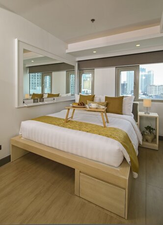 Imagen de la habitación del Hotel The Mini Suites - Eton Tower Makati. Foto 16