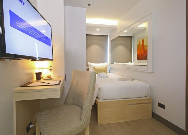 Imagen de la habitación del Hotel The Mini Suites - Eton Tower Makati. Foto 19