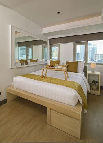 Imagen de la habitación del Hotel The Mini Suites - Eton Tower Makati. Foto 24