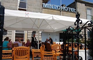 Imagen del bar/restaurante del Hotel The Minto Hotel. Foto 2