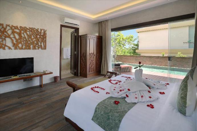 Imagen de la habitación del Hotel The Miracle Nusa Dua. Foto 14