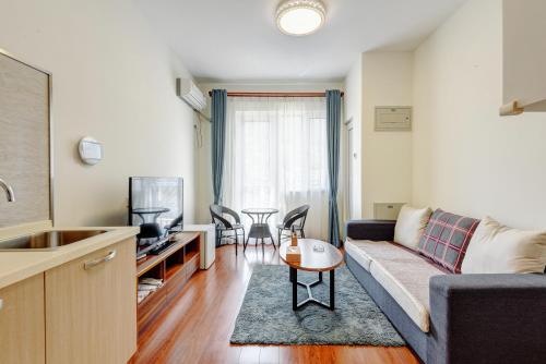 Imagen de la habitación del Hotel The Modern Holiday Villa Beijing Gubeikou Branch. Foto 6