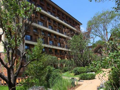 Imagen de la habitación del Hotel The Modern Holiday Villa Beijing Gubeikou Branch. Foto 7