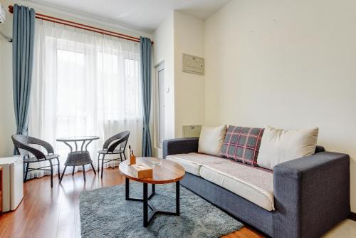 Imagen de la habitación del Hotel The Modern Holiday Villa Beijing Gubeikou Branch. Foto 8