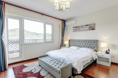 Imagen general del Hotel The Modern Holiday Villa Beijing Gubeikou Branch. Foto 5