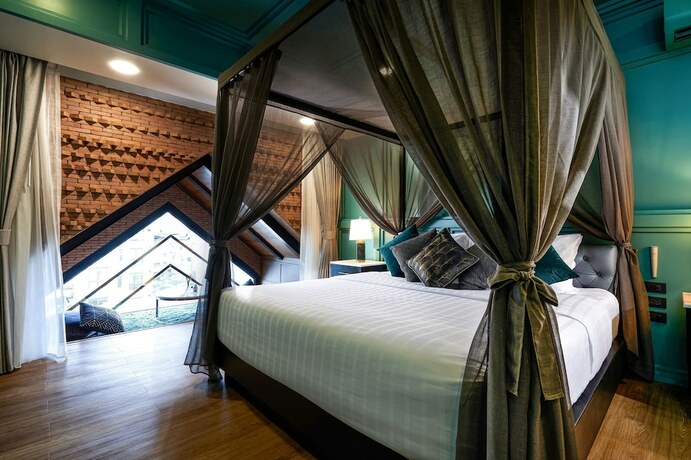 Imagen de la habitación del Hotel The Moment Chiangmai. Foto 12