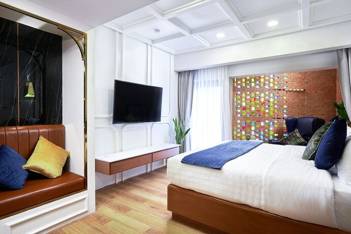 Imagen de la habitación del Hotel The Moment Chiangmai. Foto 20