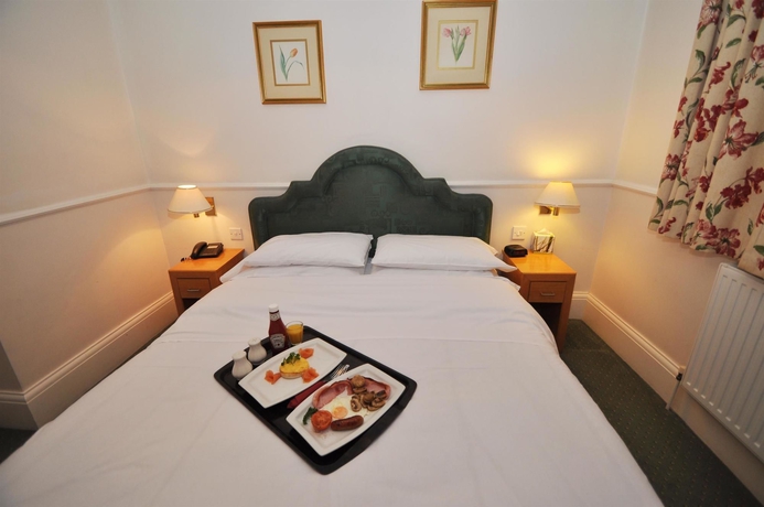 Imagen de la habitación del Hotel The Montague. Foto 9