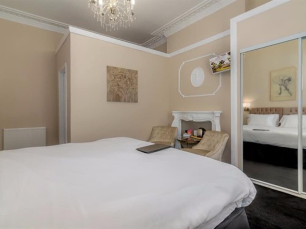 Imagen de la habitación del Hotel The Montana. Foto 13