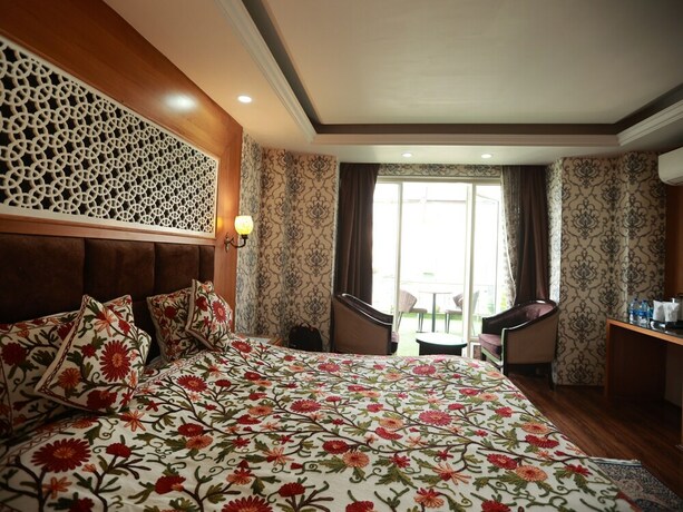 Imagen de la habitación del Hotel The Montreal Near by Dal Lake. Foto 16