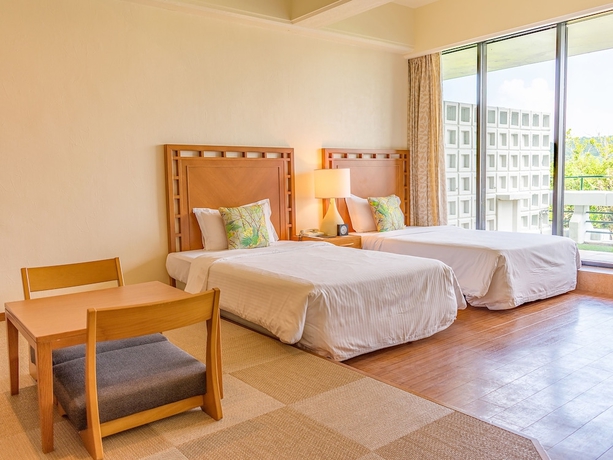 Imagen de la habitación del Hotel The Moon Beach Museum Resort. Foto 12