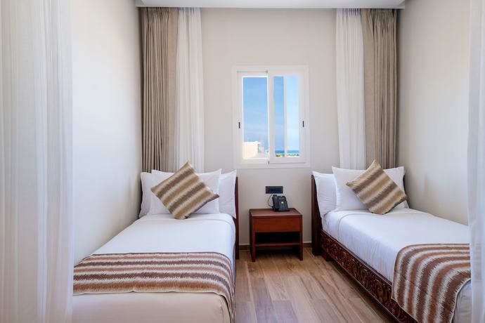 Imagen de la habitación del Hotel The Mora Zanzibar. Foto 15