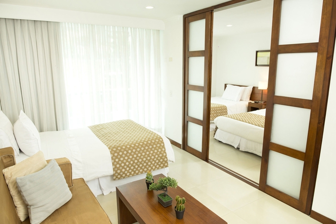 Imagen de la habitación del Hotel The Morgana Poblado Suites. Foto 8