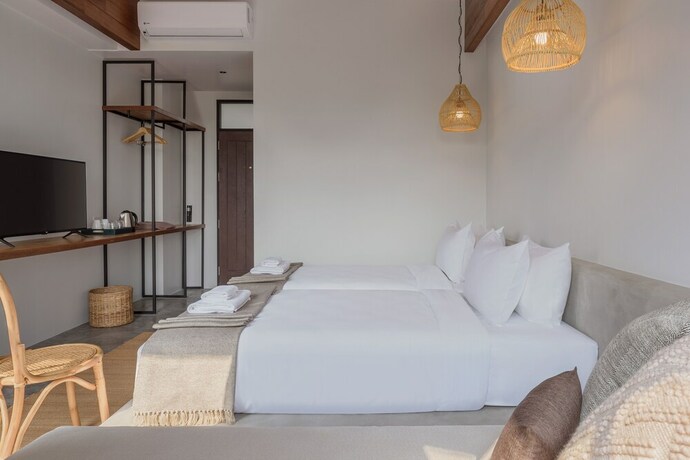 Imagen de la habitación del Hotel The Motifs Eco Hotel. Foto 14