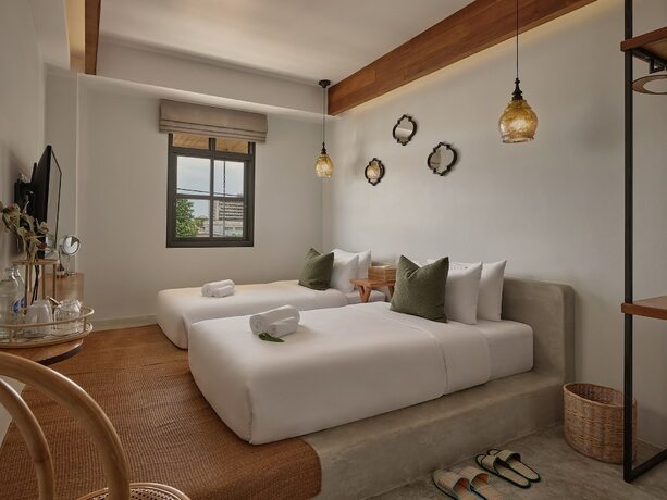 Imagen de la habitación del Hotel The Motifs Eco Hotel. Foto 15