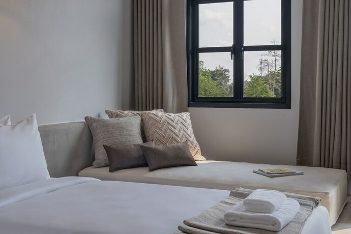 Imagen de la habitación del Hotel The Motifs Eco Hotel. Foto 28