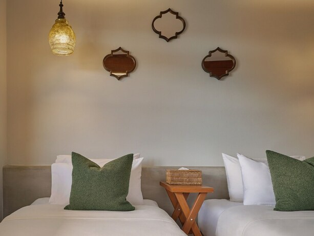 Imagen de la habitación del Hotel The Motifs Eco Hotel. Foto 29