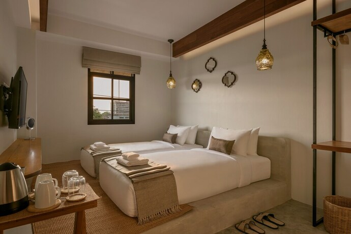 Imagen de la habitación del Hotel The Motifs Eco Hotel. Foto 32