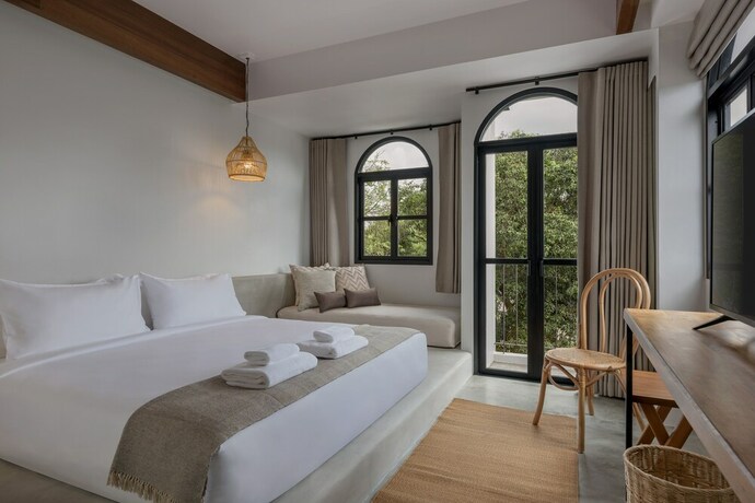 Imagen de la habitación del Hotel The Motifs Eco Hotel. Foto 33