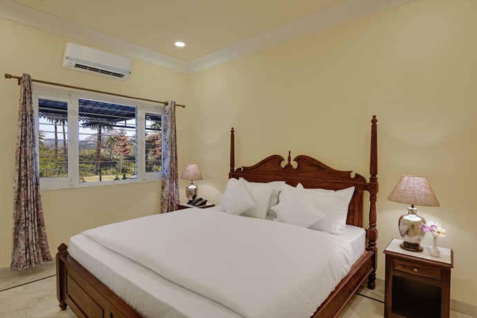 Imagen de la habitación del Hotel The Mount Bunglow - Mount Abu. Foto 8