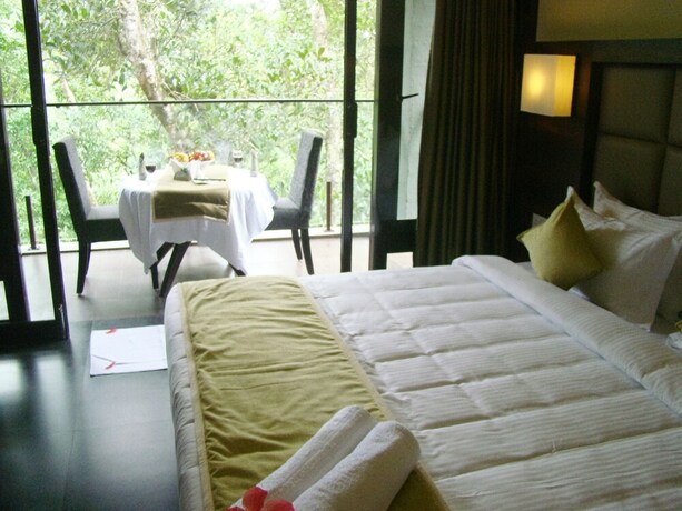 Imagen de la habitación del Hotel The Mountain Courtyard Thekady. Foto 27