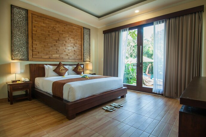 Imagen de la habitación del Hotel The Mudru Resort. Foto 13