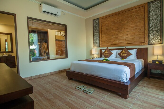 Imagen de la habitación del Hotel The Mudru Resort. Foto 16