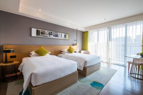 Imagen de la habitación del Hotel The Mulian Jinhai Lake Shanghai. Foto 16