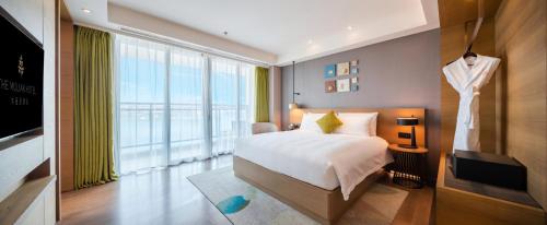 Imagen de la habitación del Hotel The Mulian Jinhai Lake Shanghai. Foto 18