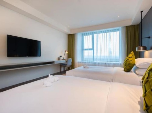 Imagen de la habitación del Hotel The Mulian Suzhou Branch. Foto 3