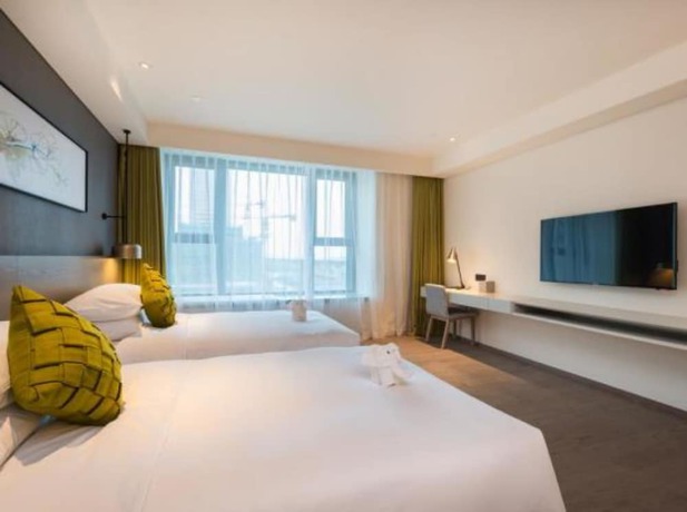 Imagen de la habitación del Hotel The Mulian Suzhou Branch. Foto 7