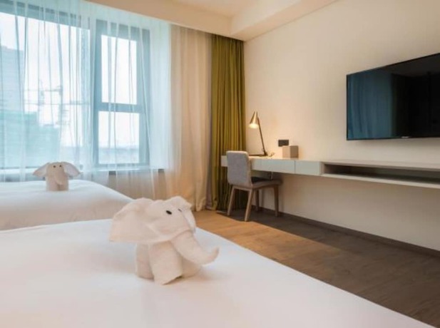 Imagen de la habitación del Hotel The Mulian Suzhou Branch. Foto 13
