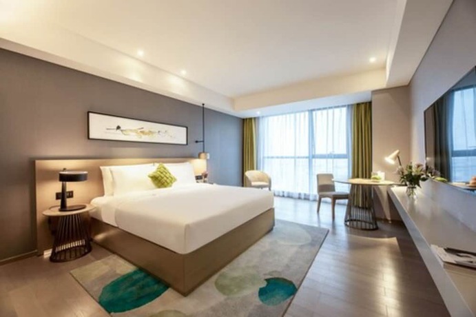 Imagen de la habitación del Hotel The Mulian Xian Wanxianghui Branch. Foto 6