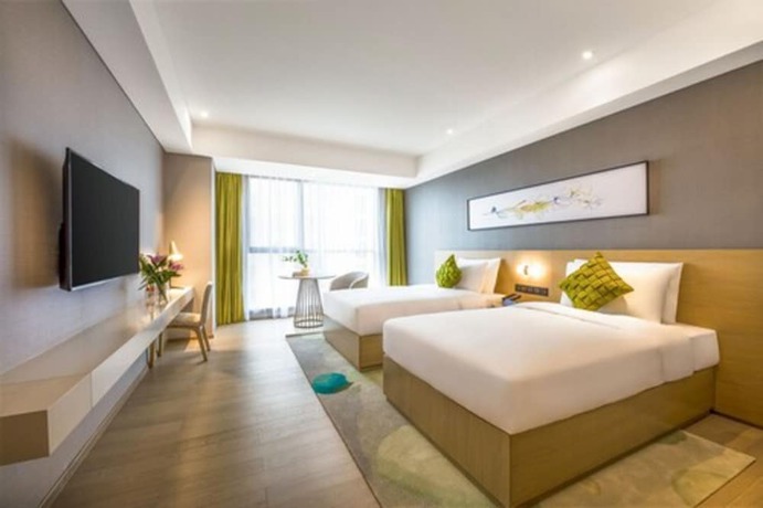 Imagen de la habitación del Hotel The Mulian Xian Wanxianghui Branch. Foto 8