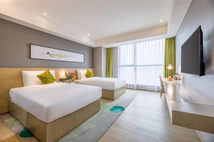 Imagen de la habitación del Hotel The Mulian Xian Wanxianghui Branch. Foto 9