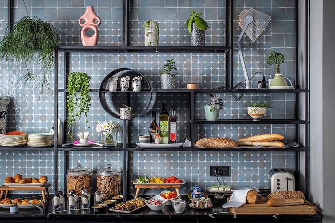 Imagen del bar/restaurante del Hotel The Muse Boutique Tel Aviv. Foto 3