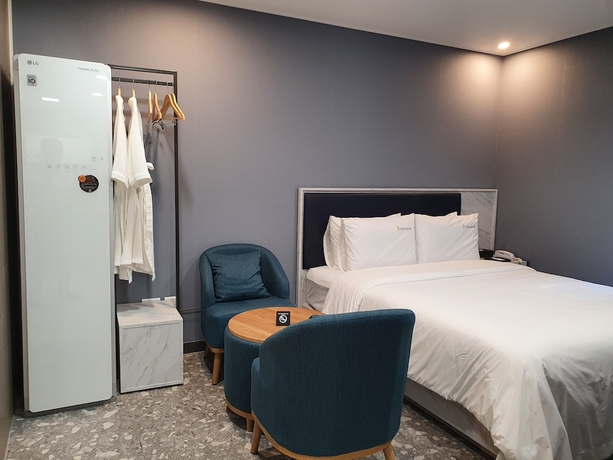 Imagen de la habitación del Hotel The Muse and Residence. Foto 12