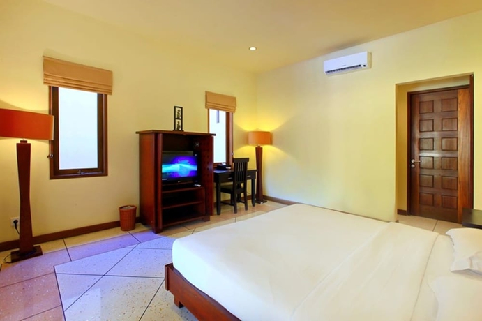 Imagen de la habitación del Hotel The Mutiara Jimbaran Boutique Villas. Foto 8