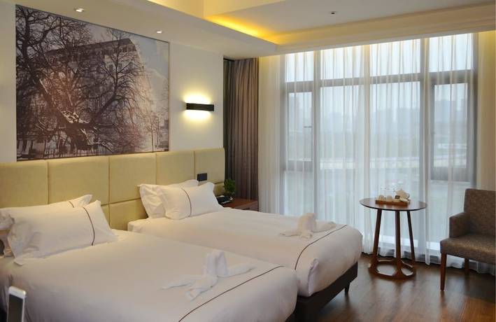 Imagen de la habitación del Hotel The Muyra Shanghai. Foto 8