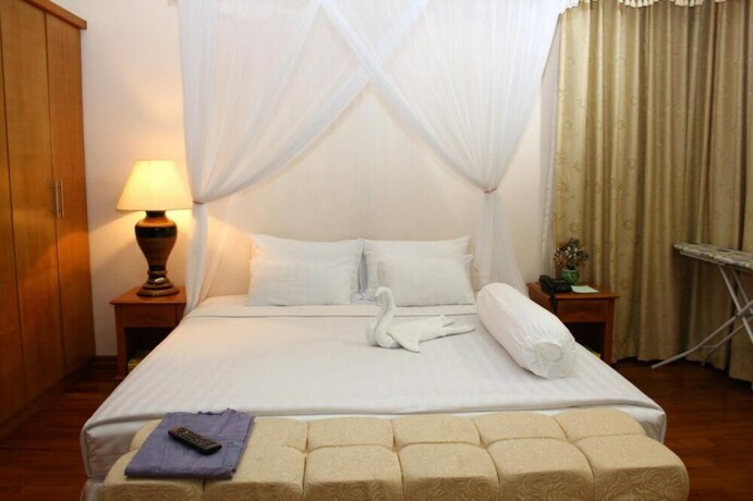 Imagen de la habitación del Hotel The Myat Taw Win. Foto 25