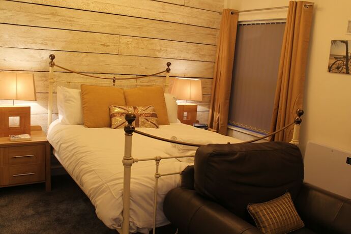 Imagen de la habitación del Hotel The Myriad. Foto 19