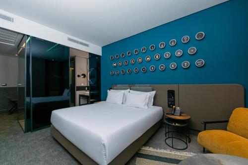 Imagen de la habitación del Hotel The NINE Lifestyle Experience. Foto 11