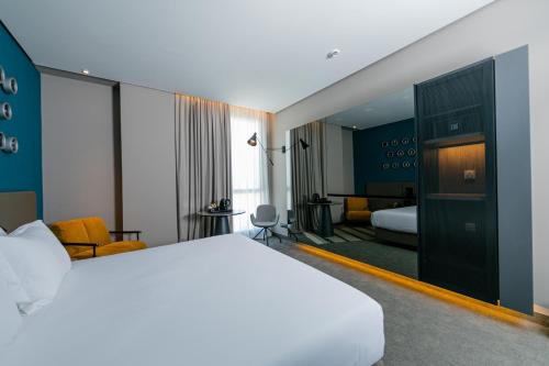 Imagen de la habitación del Hotel The NINE Lifestyle Experience. Foto 14