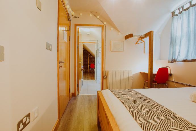 Imagen de la habitación del Hotel The Nest Boutique Hostel. Foto 9