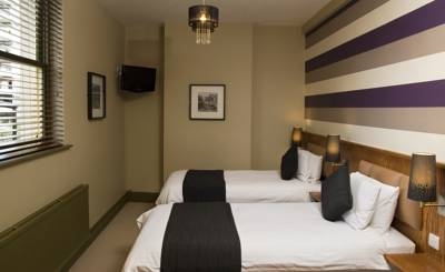 Imagen de la habitación del Hotel The New Inn. Foto 3