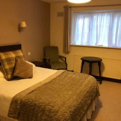 Imagen de la habitación del Hotel The New Inn. Foto 18