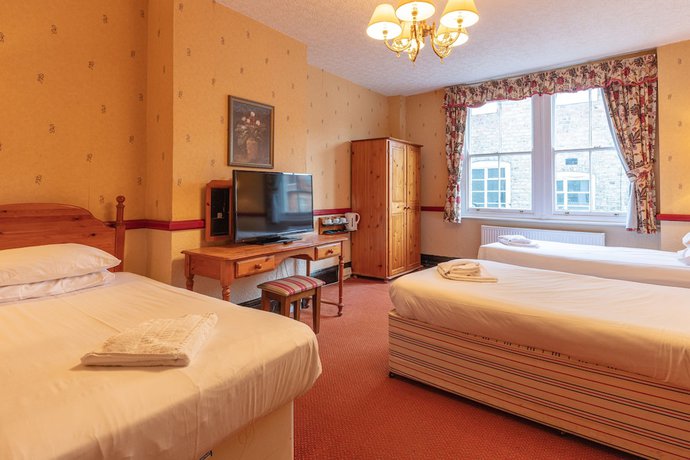 Imagen de la habitación del Hotel The New Inn. Foto 7