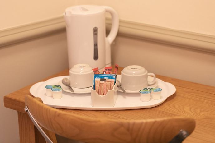 Imagen de la habitación del Hotel The New Inn. Foto 15