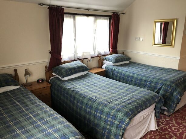 Imagen de la habitación del Hotel The New Inn Guest House. Foto 12
