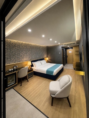 Imagen de la habitación del Hotel The New Jai Son. Foto 10